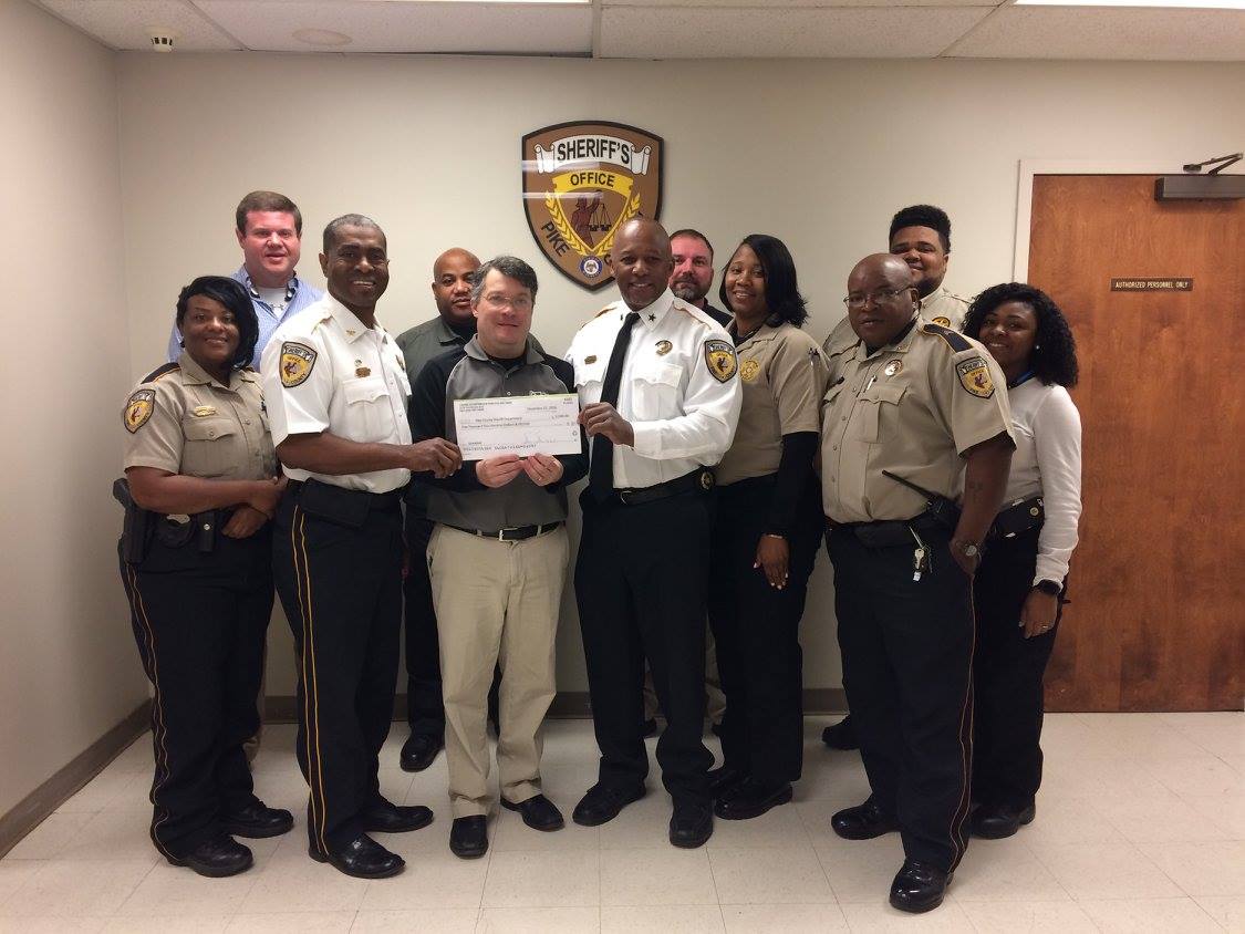 Johhny with Sheriff Kenny Cotton and other staff