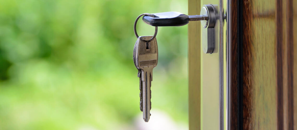 Stock image key in a door